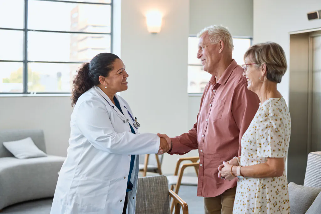 Female Provider greeting new patients for consultation